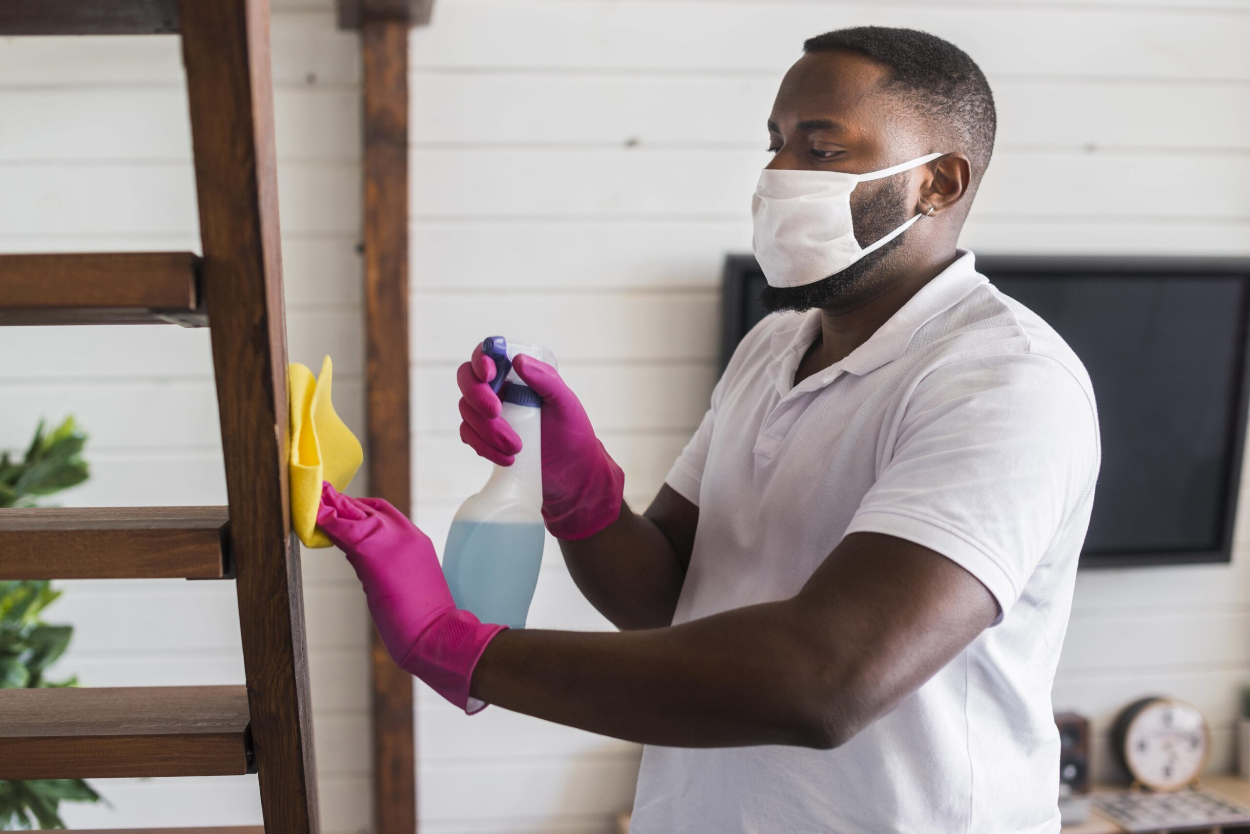 handsome man cleaning house min