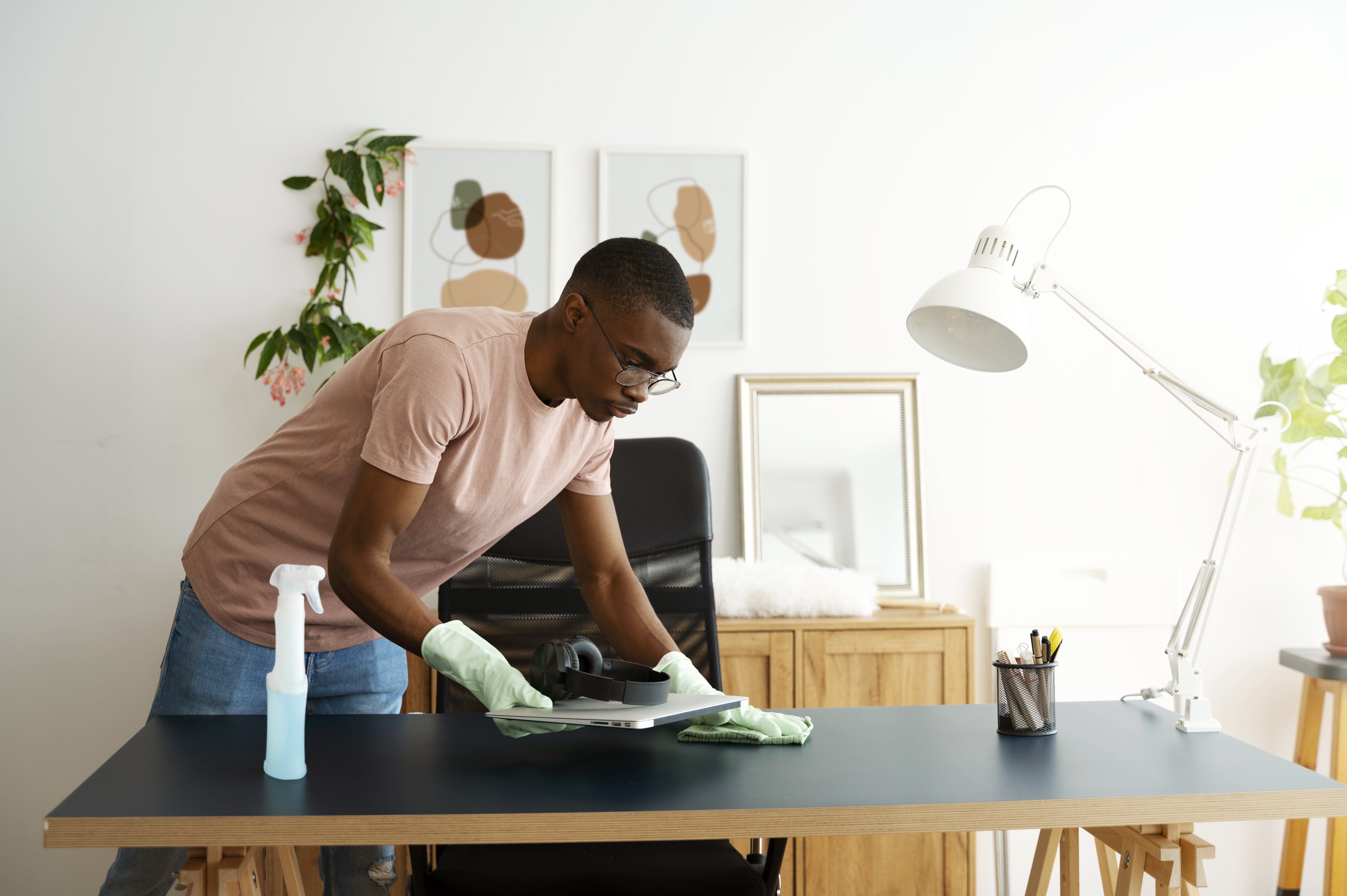 side view man cleaning table min